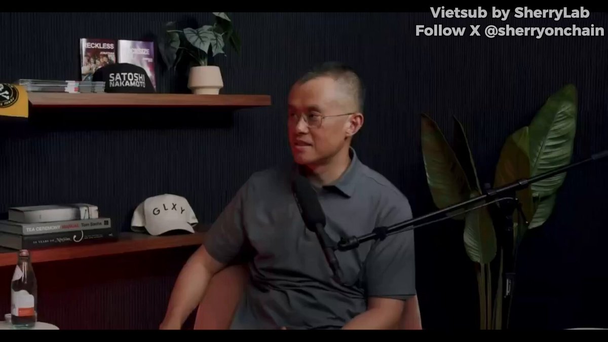 The image features a man sitting at a desk with a microphone, suggesting he might be hosting or participating in an online podcast or interview. The background includes a bookshelf filled with various items such as books and potted plants, giving off a cozy atmosphere. The caption of the image reads "A New Perspective: Quantum is not only a technological threat to Bitcoin, but it could also become the greatest test of the philosophy code is law." This statement implies that the man might be discussing the potential impact of Quantum on Bitcoin or exploring the relationship between technology and ethics in the digital age.