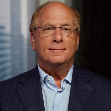 A distinguished older man with glasses, wearing a navy blazer over a light blue shirt, poses for a professional portrait likely showing Larry Fink, CEO of BlackRock, which contextualizes the breaking news of BlackRock's significant $183.4 million Bitcoin ETF purchase.