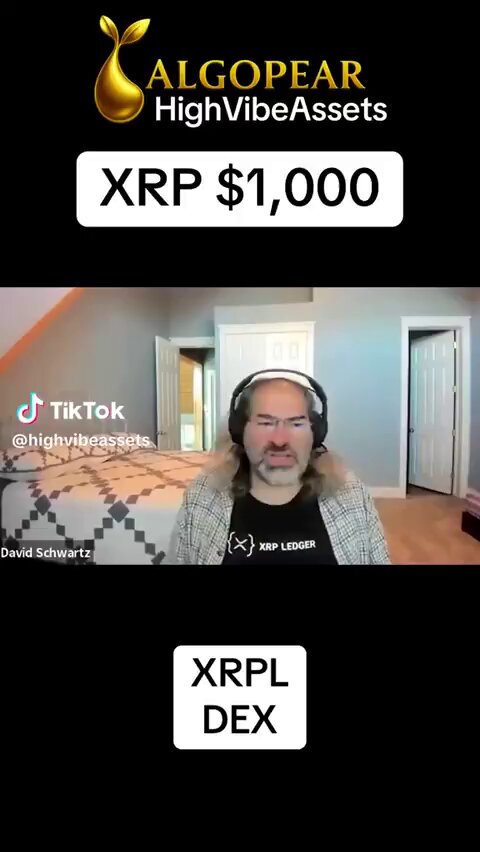 A man wearing a headset sits behind a desk with his mouth open, appearing to be talking or giving directions over a video call. In front of him, there are two signs that appear to contain information about Bitcoin, XRP, and other cryptocurrency news. The background shows a wooden floor and a doorway, indicating that the room is likely within an office space. On the image's caption, we can find several mentions related to Bitcoin, including "bitcoin," "xrpl", and "#XRIPLDE".