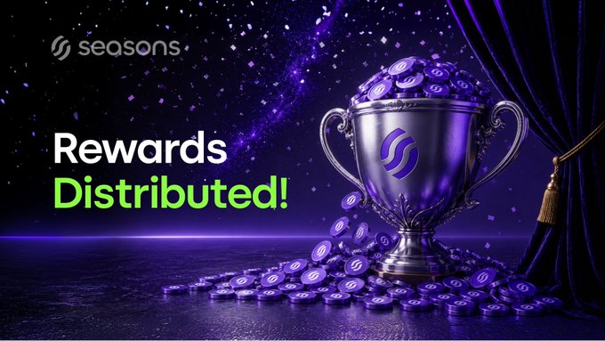 The image is a promotional graphic for the "Seasons" ($SEAS) cryptocurrency, featuring a purple-themed design with a silver trophy overflowing with branded coins spilling onto a stage, alongside text reading "Rewards Distributed!" The caption relates to the post by celebrating the distribution of 400 $SEAS tokens to winners of the "New Holder" giveaway, with the trophy and coins visually representing the rewards being delivered.
