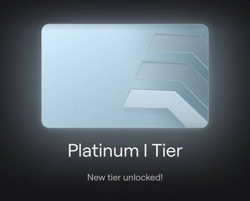 A digital tier reward card displaying 'Platinum I Tier' with text 'New tier unlocked!' beneath a silver emblem.