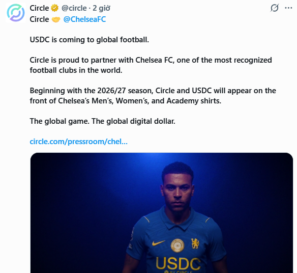 A social media post by Circle (@circle) announces a partnership with Chelsea FC (@ChelseaFC), stating that "USDC is coming to global football" beginning with the 2026/27 season on the front of Men's, Women's, and Academy shirts. The accompanying image shows a Chelsea player wearing a blue jersey prominently featuring the "USDC" logo across the chest, visually confirming the new sponsorship deal.