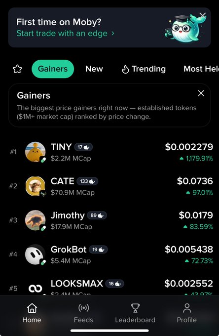 A screenshot of the 'Moby' app interface showing a 'Gainers' tab featuring tokens like TINY, CATE, Jimothy, GrokBot, and LOOKSMAX with their respective price increases and market caps.