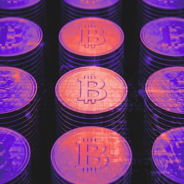 Stacks of physical Bitcoin coins with the prominent "B" logo are illuminated in vibrant orange and purple lighting. The image visually reinforces the post's theme of Bitcoin ($BTC) rallying following today's in-line CPI inflation data, which left the broader crypto market rally—including ether ($ETH)—intact.