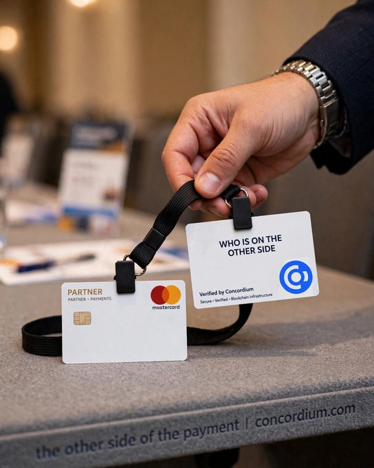 A hand holds two ID cards on a lanyard, one a Mastercard 'PARTNER' card and another stating 'WHO IS ON THE OTHER SIDE Verified by Concordium', with the text 'the other side of the payment | concordium.com' below.