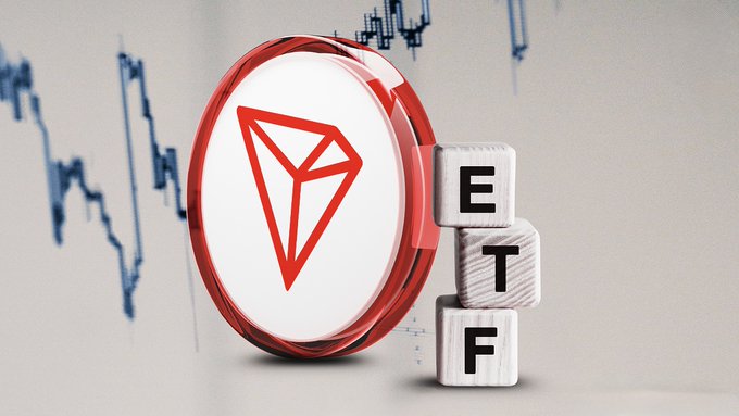 A 3D rendering shows the red Tron (TRX) cryptocurrency logo encircled in a glossy red ring next to wooden blocks spelling "ETF," set against a backdrop of a downward-trending stock chart.