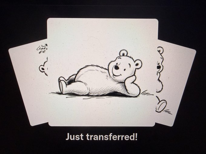 An animated illustration of Winnie the Pooh relaxing on a white card, with the text 'Just transferred!' displayed below.