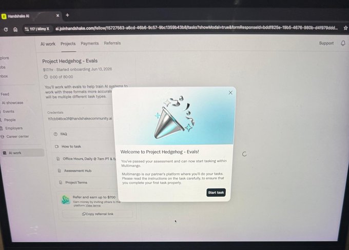 A computer screen displays the Handshake AI platform showing "Project Hedgehog - Evals" completion screen with a congratulatory pop-up message reading "Welcome to Project Hedgehog - Evals! You've passed your assessment and can now start tasking within Multimango," confirming the successful completion of the evaluation task mentioned in the post.