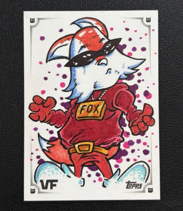 Topps trading card featuring a stylized fox character wearing sunglasses, a red hoodie with 'FOX' on the chest, labeled 'VF' (Very Fine) condition with Topps branding.