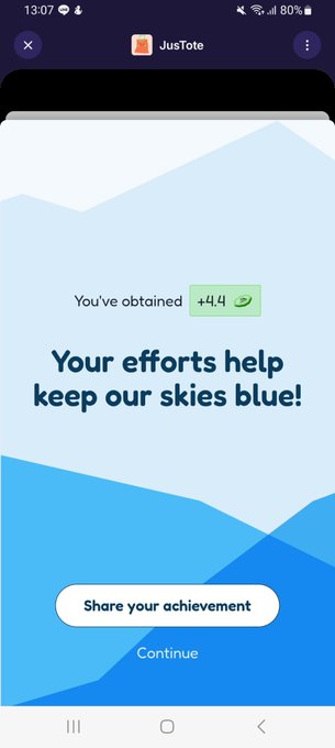 A mobile phone screen displays a "JusTote" app notification stating "You've obtained +44" with the message "Your efforts help keep our skies blue!" and a "Share your achievement" button.