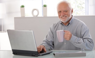 A smiling older man sits at a desk holding a pink mug while looking at his laptop, appearing satisfied after a simple and affordable purchase. The humor of the post lies in the contrast between the $30 eye scan and his overly content, almost smug expression over such a minor expense.