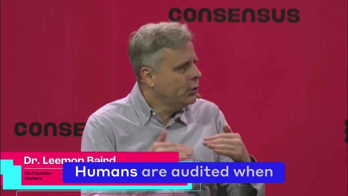 The image features a man wearing a grey shirt giving a speech or presentation. The background of the image has red text that reads "Consensus", which suggests that this could be an event related to the Consent ecosystem, possibly featuring speakers discussing the future of agentic payments and the importance of trust in such systems.