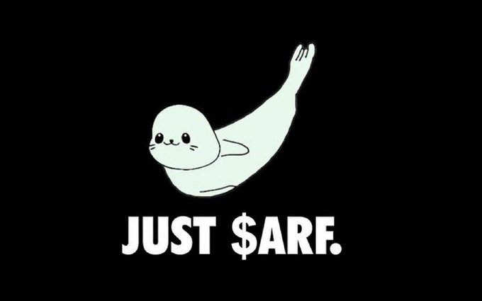 A simple white seal on a black background with one flipper raised in a wave, accompanied by the text 'JUST $ARF.'