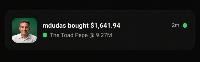 A notification card shows that user "mdudas" bought $1,641.94 worth of "The Toad Pepe" at a market cap of 9.27M, marked as occurring 2 minutes ago, matching the accompanying post's transaction details.