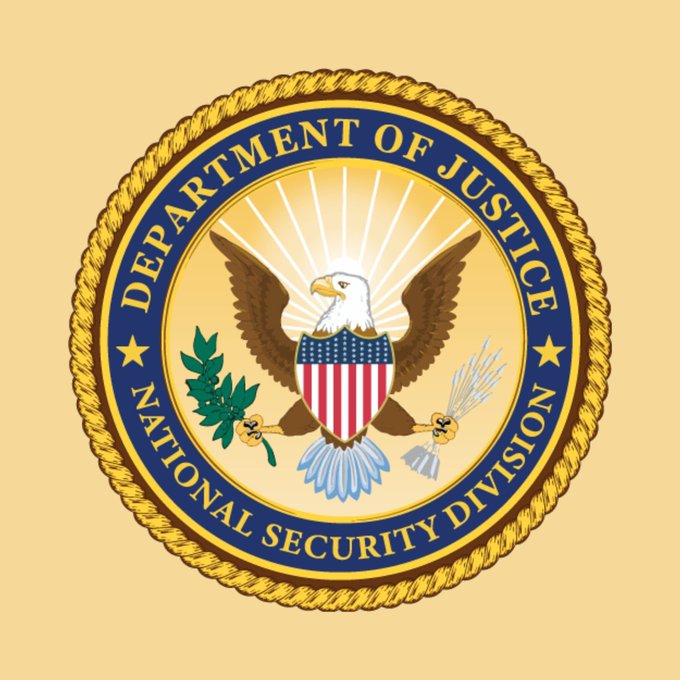 Official seal of the Department of Justice National Security Division featuring an eagle with a shield, olive branch, and arrows on a gold background.