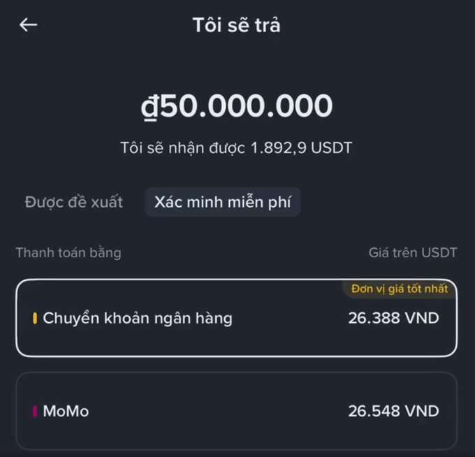 A Vietnamese cryptocurrency exchange withdrawal screen showing a transaction of 50,000,000 VND receiving 1,892.9 USDT, with payment options for bank transfer (26,388 VND) or MoMo (26,548 VND).