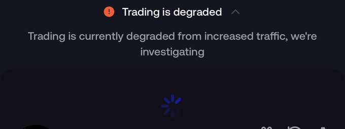 A dark-themed interface displays a red warning banner reading "Trading is degraded" with the message "Trading is currently degraded from increased traffic, we're investigating" and a blue loading spinner below. This relates to the post by showing a platform outage that is preventing cate holders from executing sell orders amid a downturn.