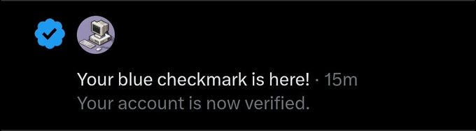 Notification message stating 'Your blue checkmark is here! · 15m Your account is now verified.' with a blue verified badge icon.