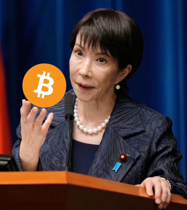 A portrait of a woman speaking at a podium, overlaid with a large Bitcoin (BTC) symbol, illustrating the social media post's context regarding the establishment of BTC.
