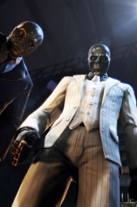 A stylized image of two figures in suits wearing skull masks, with one holding a gun, set in a dark atmospheric scene.