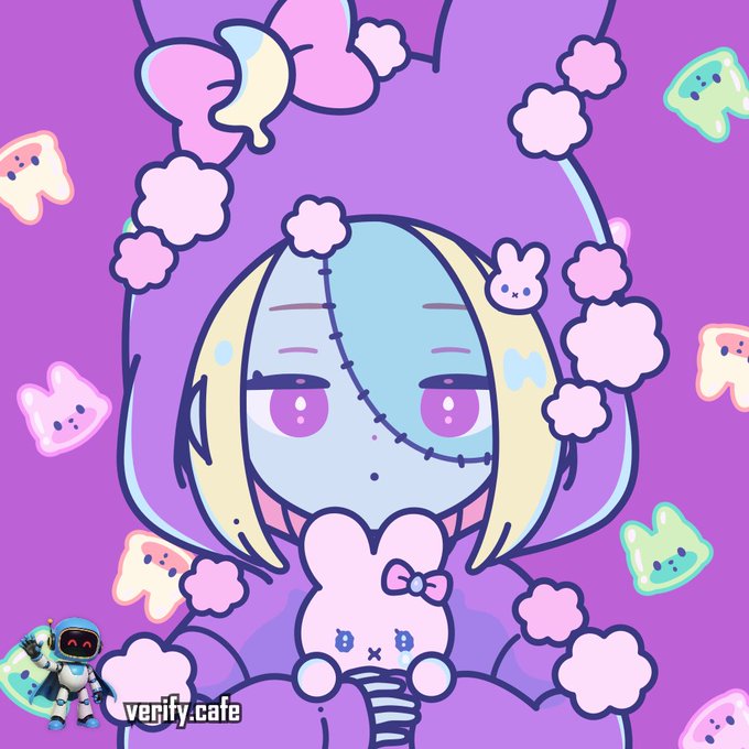 A digital illustration of a blue-skinned character with blonde hair, stitches on her face, and pink flower accents on a purple background includes a watermark reading 'verify.cafe' and a small robot figure in the corner.