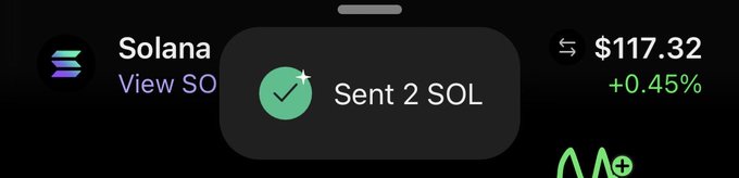 Mobile interface showing a Solana transaction confirmation with 'Sent 2 SOL' notification and a current SOL price of $117.32 (+0.45%).