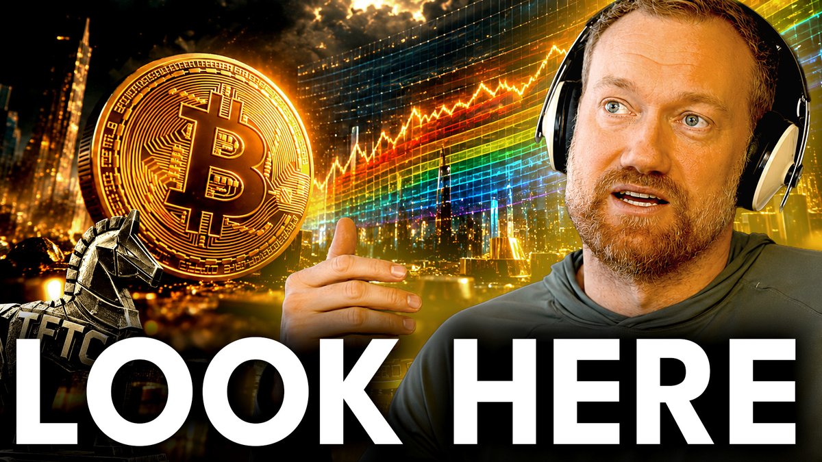 A YouTube thumbnail featuring a man with headphones pointing toward a Bitcoin coin and a city skyline with colorful charts, with the text 'LOOK HERE' overlaid.