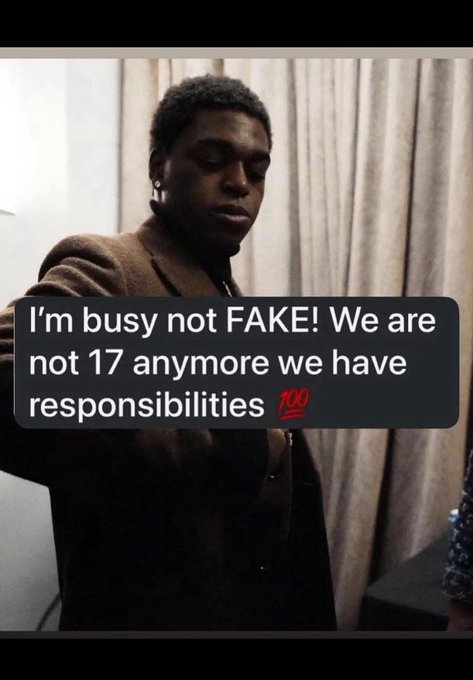 The image shows a young Black man in a brown jacket with his eyes closed, looking down in an exasperated or tired expression, overlaid with a text message reading: "I'm busy not FAKE! We are not 17 anymore we have responsibilities 💯". The meme humorously conveys the weariness of being constantly online and busy with crypto/web3 commitments, fitting the post's lament about juggling Instagram, Twitter posts about $Ansem, and hoping for an airdrop payout.