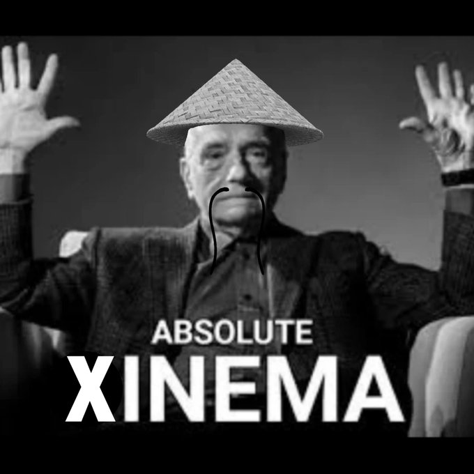 A black and white image of an older man in a conical hat with hands raised, edited with a drawn-on mustache and text 'ABSOLUTE XINEMA'.