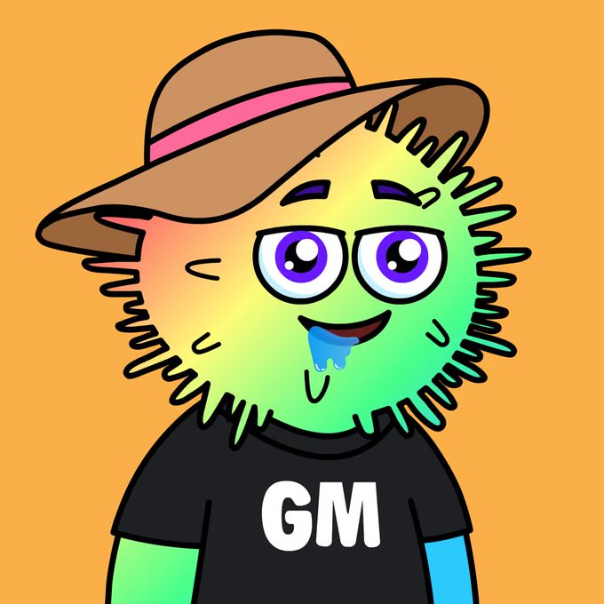 A cartoon illustration features a spiky green and yellow character wearing a brown hat with a pink band, drooling blue, against an orange background, wearing a black shirt that says 'GM'.