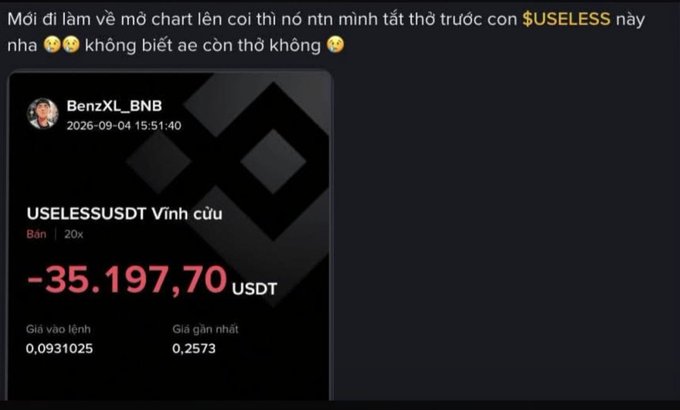 A Vietnamese social media post showing a massive crypto loss of -35,197.70 USDT on the token $USELESS, with text expressing shock and exhaustion.