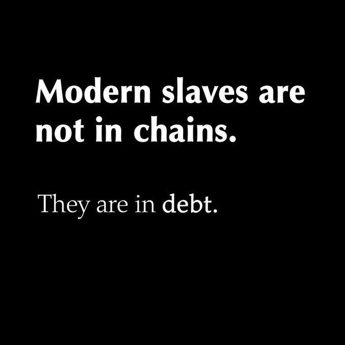 A black background with white text reading 'Modern slaves are not in chains. They are in debt.'