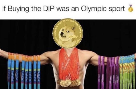 A 'Doge to the moon' meme showing a muscular figure draped in Dogecoin medals wearing a Shiba Inu gold coin, captioned 'If Buying the DIP was an Olympic sport.'