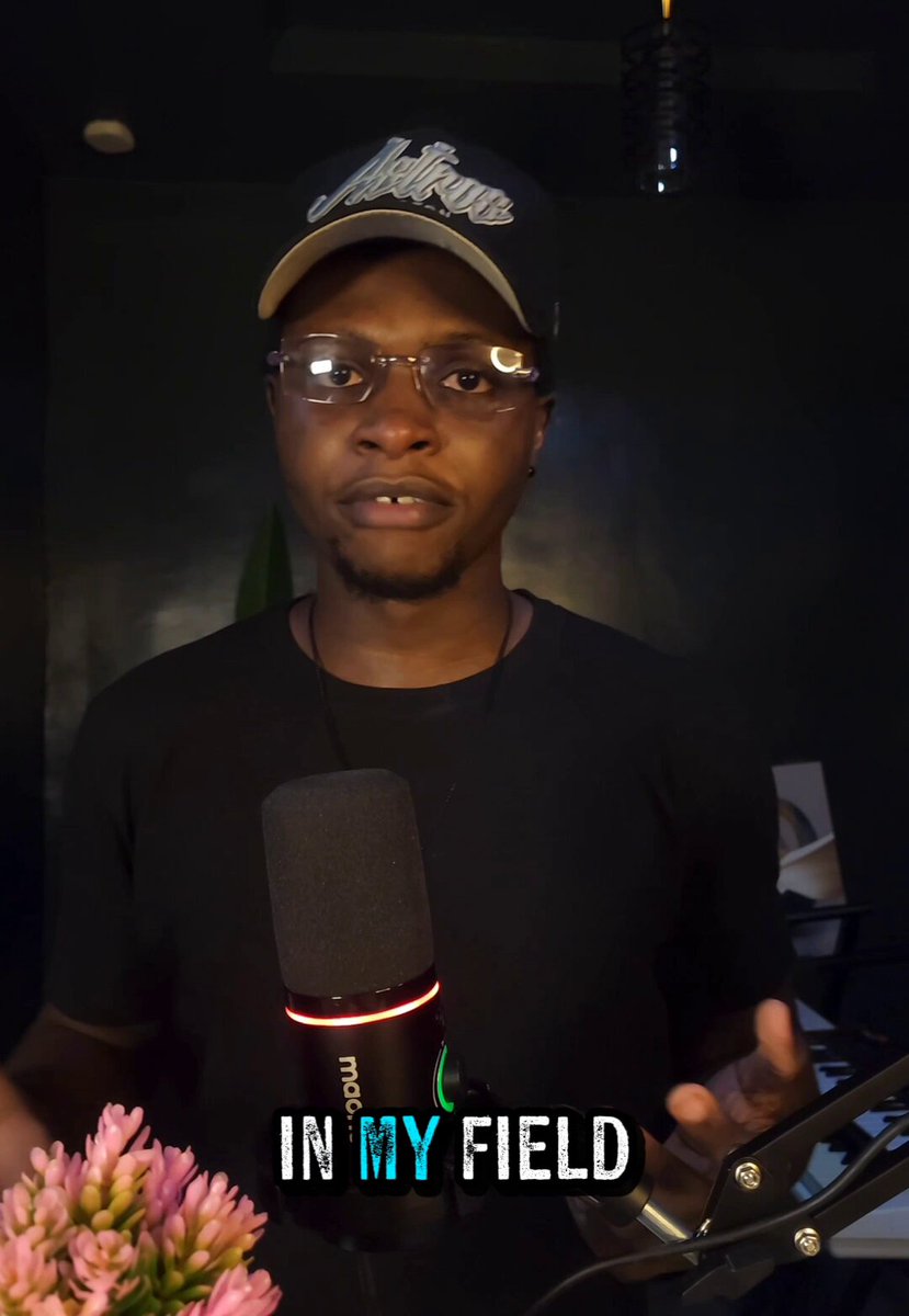The image features a man wearing glasses and a black shirt holding a microphone with the text "In My Field" written on it, which appears to be related to the CodecFlow SimArena. The man seems to be speaking into the microphone or presenting something related to the software.