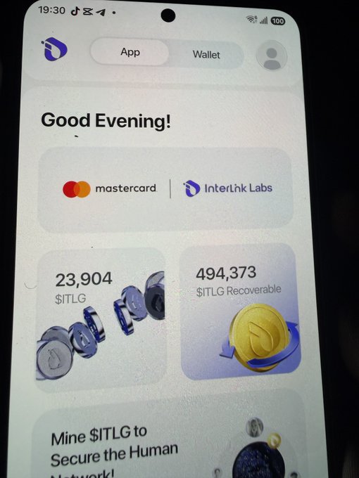 A smartphone displays the Interlink Labs app dashboard showing "Good Evening!" with 23,904 $ITLG and 494,373 $ITLG Recoverable balances alongside a Mastercard partnership banner. The image supports the poster's return to the Interlink ecosystem, visually confirming their on-chain holdings after stepping away from previous skepticism about the $ITLG project.