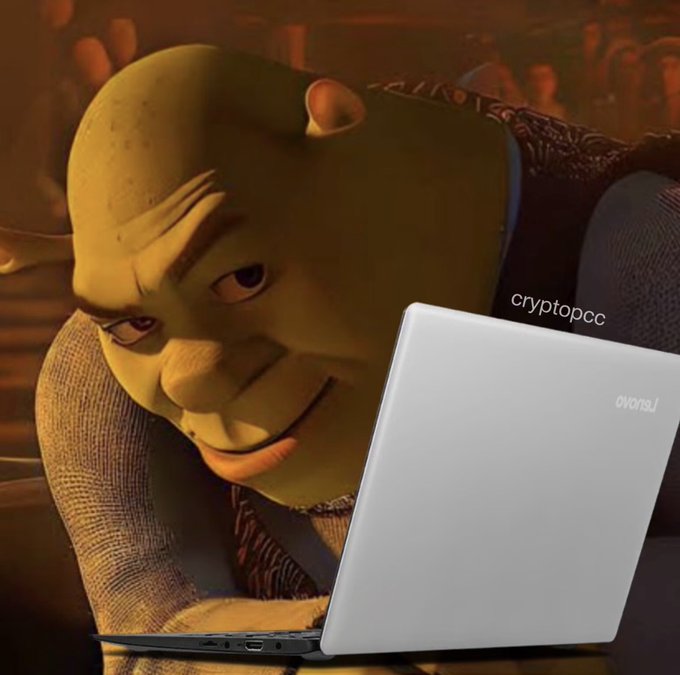 A meme featuring Shrek looking intently at a white Lenovo laptop screen, with the watermark 'cryptopcc' visible.