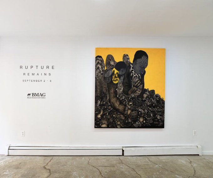 An art gallery display featuring a dark, textured painting with a yellow face, titled 'RUPTURE REMAINS' running 'SEPTEMBER 2 - 6' at BMAG (Black Mountain Art Gallery).