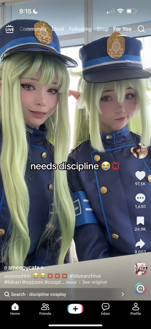 A TikTok screenshot showing two people in blue archive police cosplay with green wigs, captioned 'needs discipline' from user @smexycats (97.5K likes).
