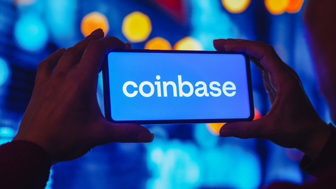A person holds a smartphone displaying the Coinbase logo against a neon-lit background, with the company's ticker $COIN referenced in a post reporting Q2 earnings that missed analyst estimates across revenue, EPS, transaction revenue, and subscription revenue.
