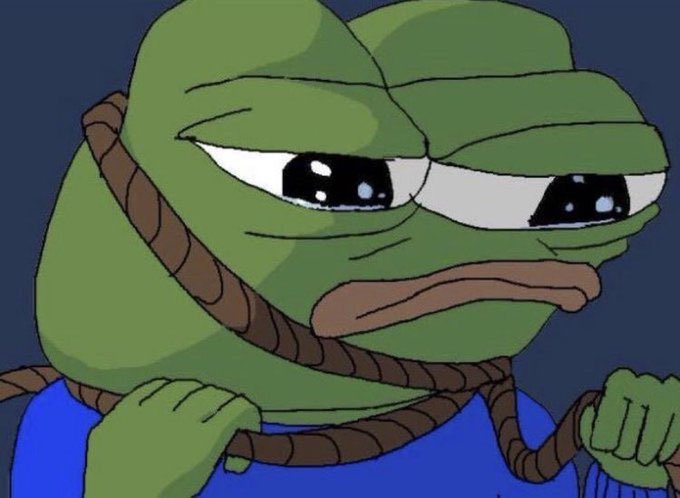 The image shows the "Sad Pepe" frog meme with teary, droopy eyes and a rope around its neck, wearing a blue sweater, conveying deep defeat. It humorously illustrates the post's warning about losing money in memecoins, perfectly capturing the emotion of someone who just got rugged.
