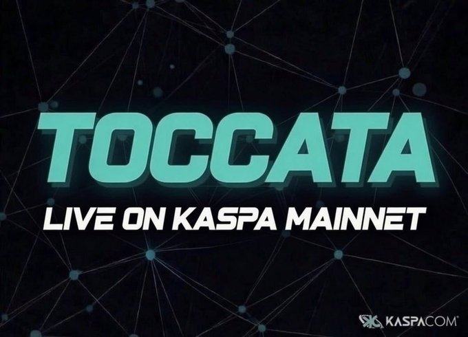 A bold announcement graphic featuring the glowing teal word "TOCCATA" against a dark networked background, with the tagline "LIVE ON KASPA MAINNET" and the KaspaCom (KASPA.COM) logo, visually announcing the launch of the Toccata hardfork on the Kaspa blockchain.