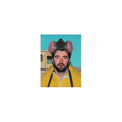 A portrait of a man wearing a yellow jacket and a black hat with pink animal ears, with a blurred RV in the background.