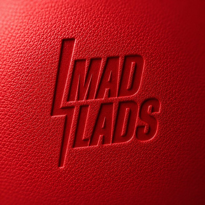 A close-up of a red textured leather surface with the embossed 'MAD LADS' logo featuring a lightning bolt design.