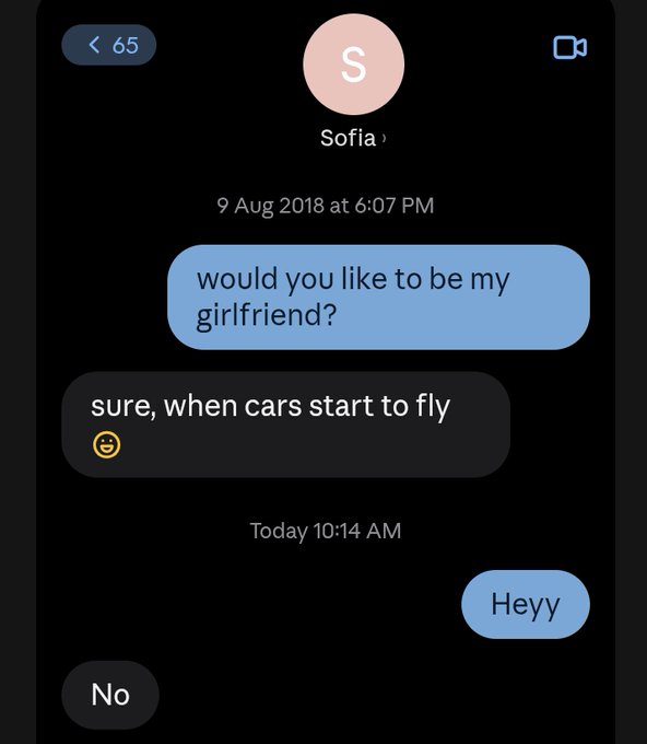 A text message conversation where 'Sofia' rejects a 'will you be my girlfriend?' request by saying 'sure, when cars start to fly' with a smiley emoji.