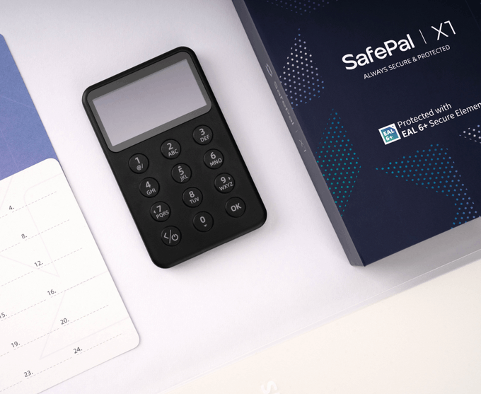 A SafePal X1 hardware wallet device with a keypad, shown next to its navy blue packaging box labeled 'SafePal | X1 ALWAYS SECURE & PROTECTED' and 'Protected with EAL 6+ Secure Element'.