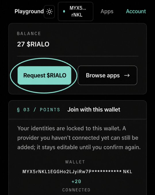A mobile app screen showing a wallet balance of 27 $RIALO with a circled 'Request $RIALO' button and a connected wallet address (MYX5rNKL1EGGHo2LJyiRw7P***********NKL).