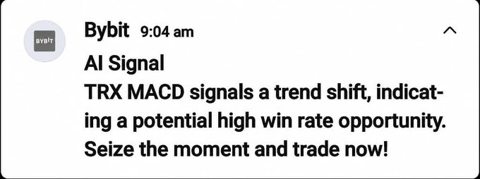 The image features a post from Bybit on their social media account that includes an email message containing an AI trading signal related to the TRX momentum index. The email indicates that the latest AI trading signal has shown that the market trend is shifting towards "TRX Momentum". This information is being shared with those who follow Bybit's social media account, as seen by the "@Bybit_Official" tag in the image.
