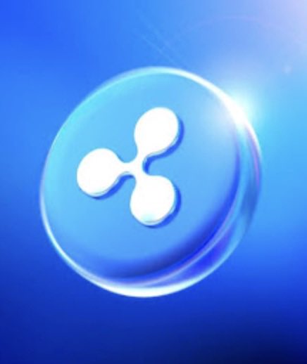 The Ripple (XRP) cryptocurrency logo appears as a white three-pronged pinwheel symbol inside a translucent blue glass sphere with a bright light flare.