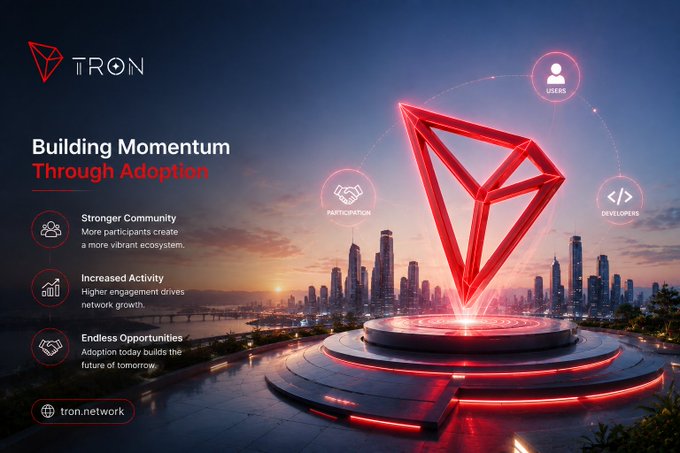 A promotional graphic for TRON cryptocurrency with the headline 'Building Momentum Through Adoption', featuring a glowing red Tron logo over a city skyline, with icons for 'Stronger Community', 'Increased Activity', and 'Endless Opportunities'.