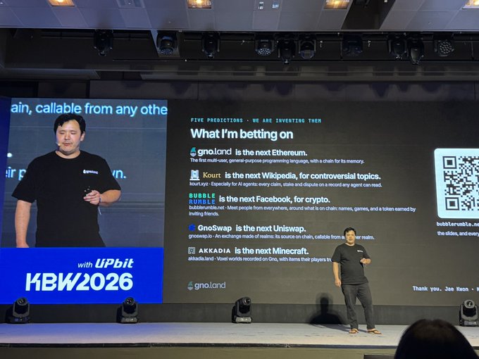 A man presents on stage at the KBW2026 conference with a large screen behind him displaying 'FIVE PREDICTIONS - WE ARE INVENTING THEM' and listing various crypto projects including gno.land, Kourt, BUBBLE, GnoSwap, and AKKADIA.